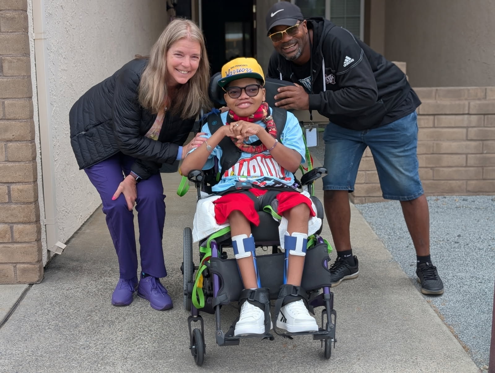Mike with Nurse Terry and bus driver Lee on his first day of school.